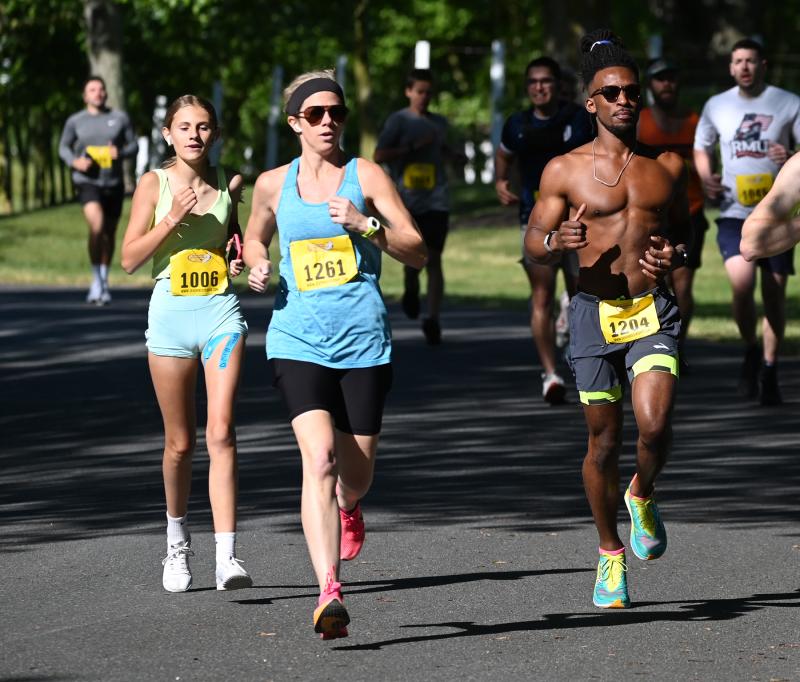 Melissa Wiley, 38, of Ocean City, Md., center, gets to the front early. She won the women’s title with a time of 20:41. Keeping pace are Hayley Britt, 13, of Selbyville, left, and Sean Norris, 32, of Lewes.