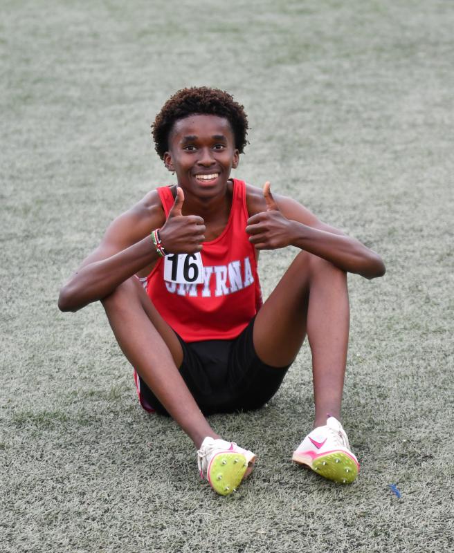 Mugo Waweru of Smyrna is still smiling after running a 10:15 in the 3,200 meters.