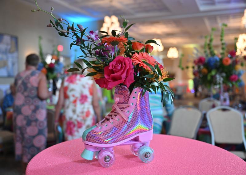 A roller skate adorns the table as an ’80s centerpiece.