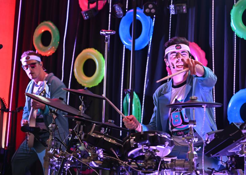 Decade80’s Justin Fisher on drums and Taylor Knox on guitar perform all the hits.