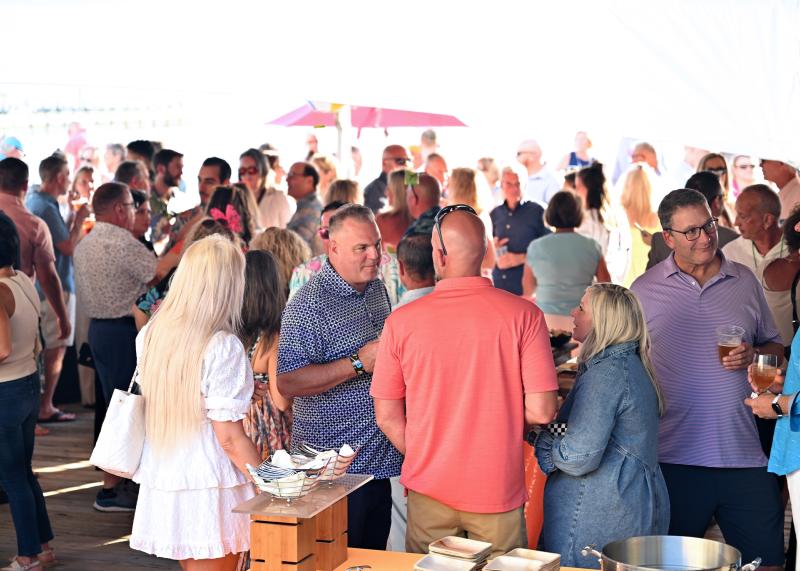 The crowd on the deck enjoys perfect weather.