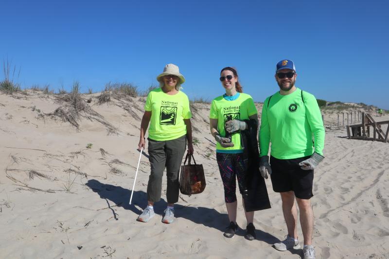 Along the dunes was a good place for (l-r) Friends of Cape Henlopen State Park board member MJ Camdex, Kate Langley and Alex Langley to pick up trash.