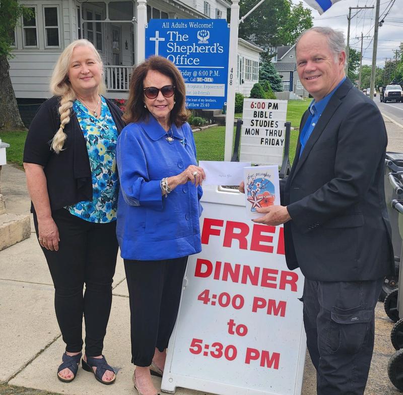 Jim Martin, Shepherd’s Office executive director, accepts a $1,000 grant from General Federation of Women’s Clubs State President Trish Rodriguez, center, and Deborah Johnson, vice president, left. SUBMITTED PHOTO