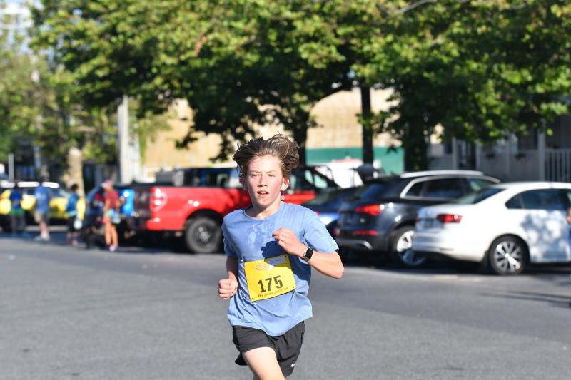 Atticus Mingo, 12, runs to a time of 20:40.