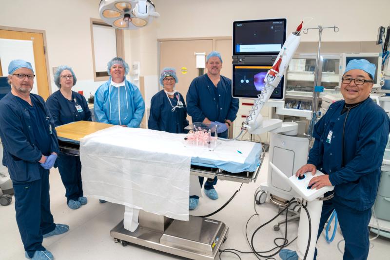 Beebe Healthcare professionals shown around the new Ion Endoluminal System are (l-r) registered respiratory therapists Brad Ritzler, Joanne Hoffman, Chris Steele, Angie Howard and Rudy Daisey; and Victor Banzon, MD, board-certified pulmonologist. SUBMITTED PHOTO