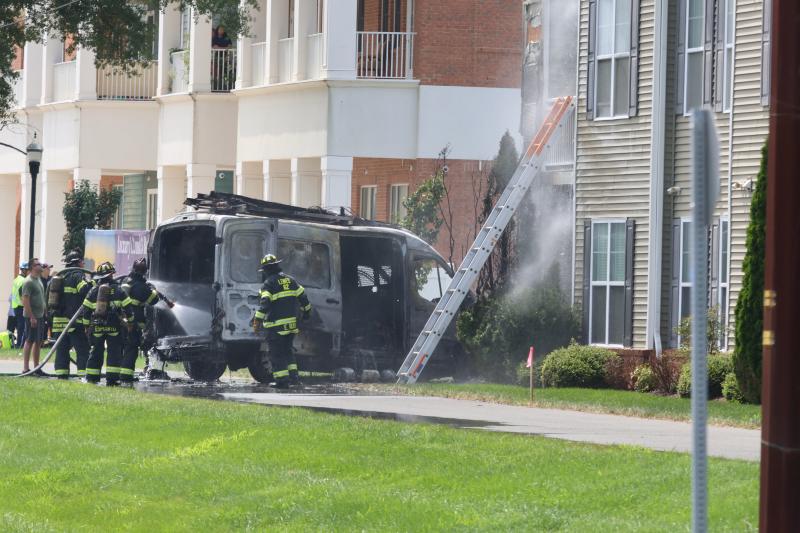 A van involved in the incident left the road and crashed into the front of an apartment building at The Vineyards. The van and at least one apartment caught fire. BILL SHULL PHOTOS
