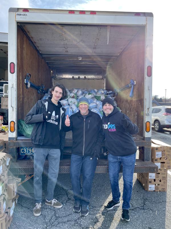 Anthony Palermo, middle, and fellow volunteers assist with the 2022 Turkeython that benefits the Ministry of Caring.