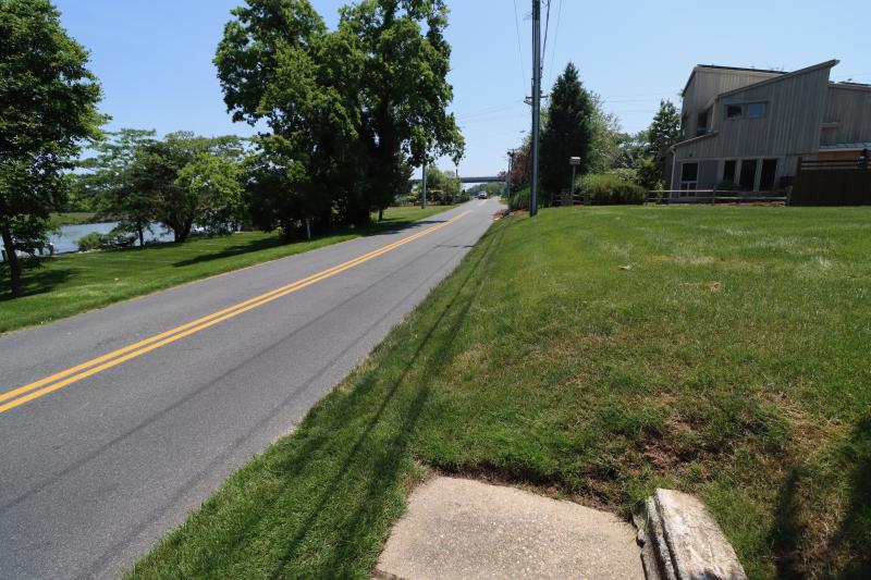 This stretch of Gills Neck Road is one that many consider to be hazardous for bicycles and pedestrians. Developer Showfield LLC has upped its proffer to more than $240,000 toward safety improvements on that part of the roadway. BILL SHULL PHOTO