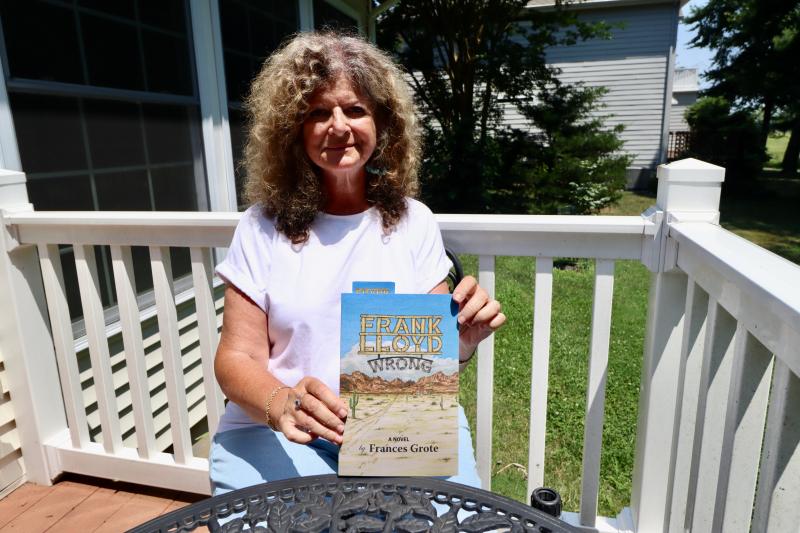 Frances Grote holds a copy of her third book, “Frank Lloyd Wrong.” She describes the novel as a book about “a family where obviously something is wrong, but not wrong enough to be obvious.”
BILL SHULL PHOTO
