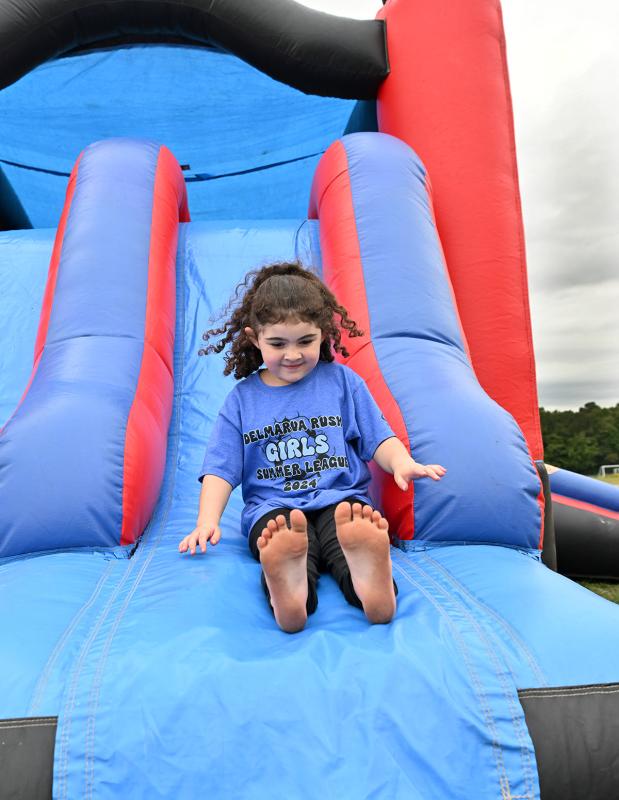 Gabrielle Lopez, 6, enjoys an exhilarating ride on the bouncy house.