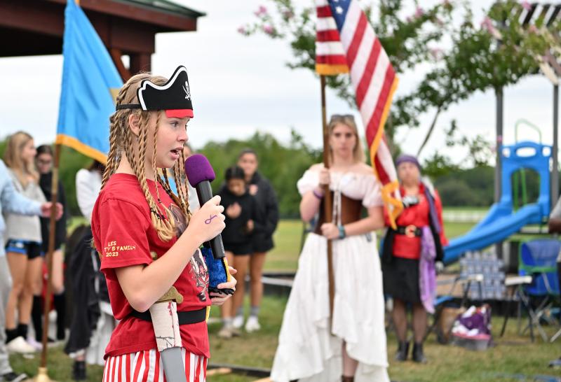 Charli Evans, 11, sings the national anthem.