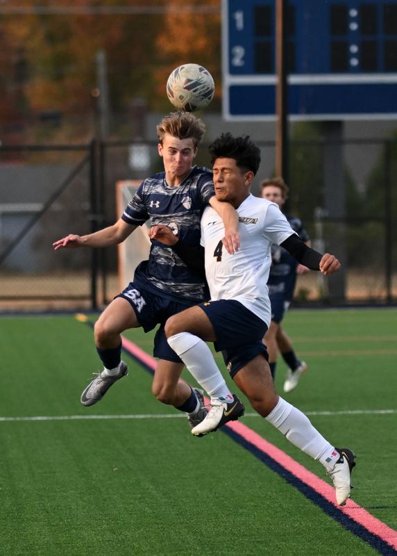 Sussex Academy sophomore Nathan Falcone takes on Seaford’s Yosgart Guadarrama-Valentin.