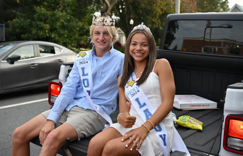 Max Wyshock and Tegan Peczek ride the parade route as Freshmen Lord and Lady.