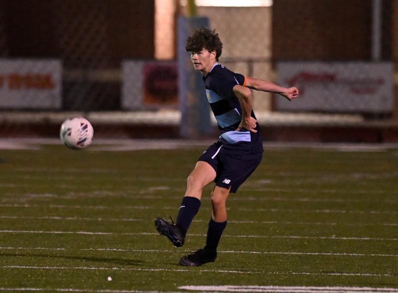 Cape senior Jack Flynn boots the ball toward the Central goal.