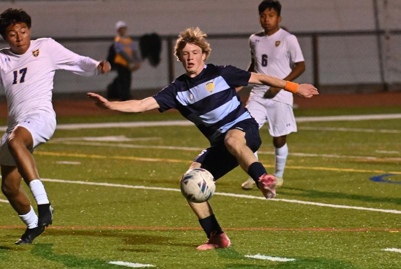 Brady Spiegel controls a high bouncer.