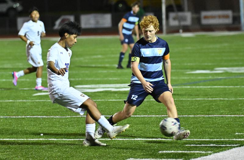 Cape senior Brandon Loucks cuts off the passing lane for Central’s Frank Perez-Romero.