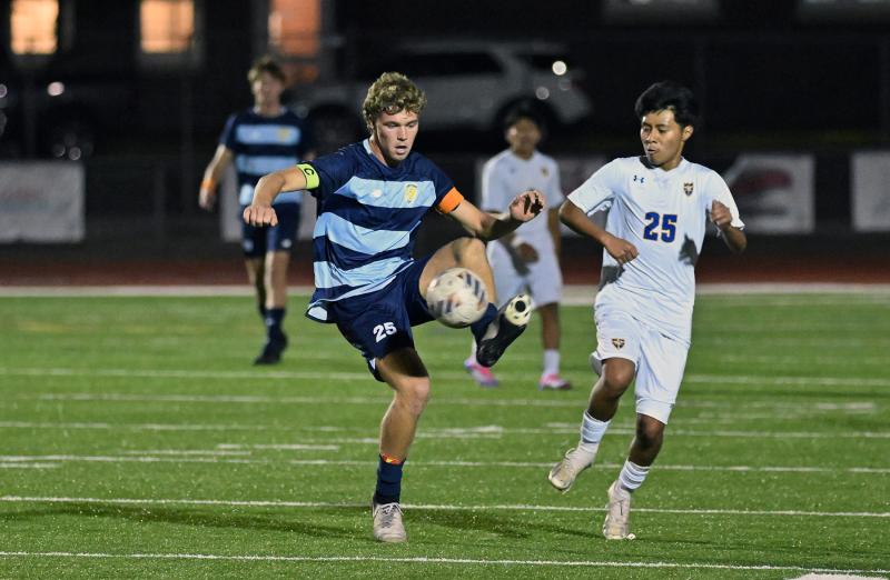Evan Burris knocks down a pass intended for Central’s Frank Perez-Romero.