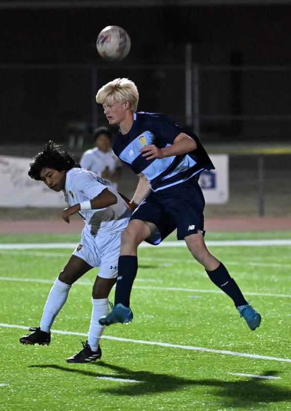 Cape’s Brenner Short heads the ball away from Central’s Richard Ortiz Roblero.