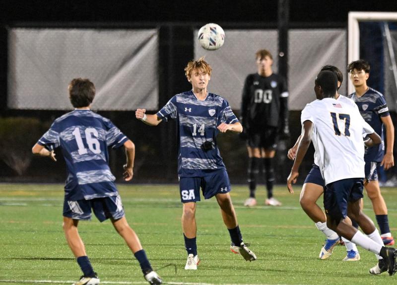 Aleksander Danilenko heads the clear for the Seahawks.