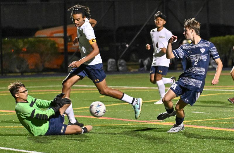 Sussex Academy’s Theodore Layton takes a shot on goal.