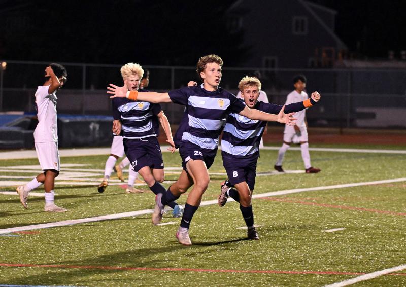 Austin Tyndall celebrates his goal with four minutes remaining to tie the game and send it into overtime. DAN COOK PHOTOS