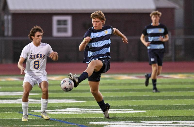 Cape senior Evan Burris traps a ball for control away from the Riders’ Ethan Swearingen.