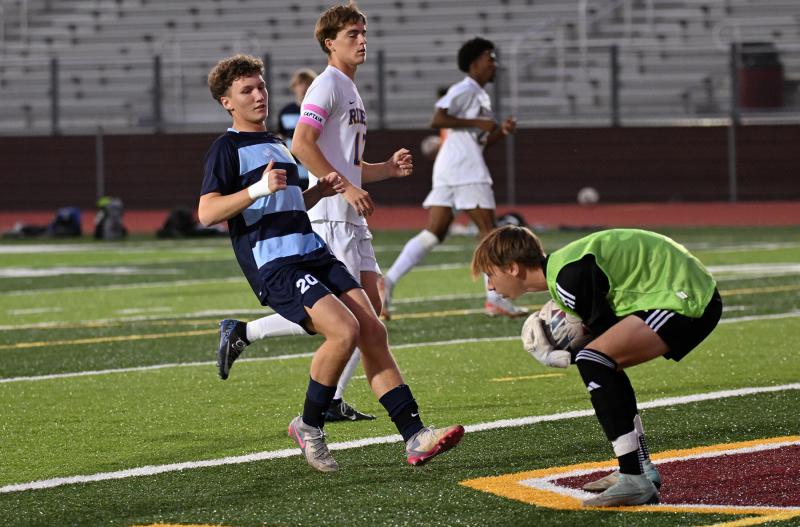 Cape sophomore Austin Tyndall follows the ball toward CR goalie Grant Parsons.