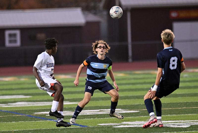 Cape’s Cardin Benjamin, center, eyes an opportunity as his brother Seth looks on.
