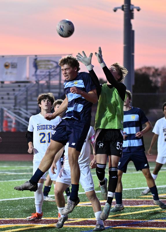 Cape senior Evan Burris and Riders goalie Grant Parsons battle for a corner kick in front of the CR cage.