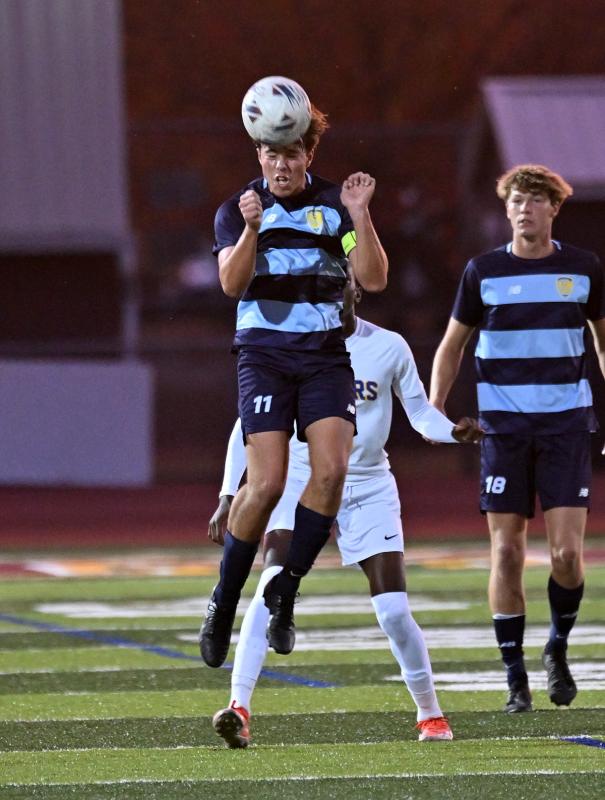 Cape defender Jerzy Haines clears a ball via the header.