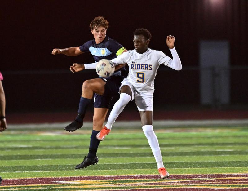 Cape’s Jerzy Haines and CR’s Jamal Richards battle for possession.