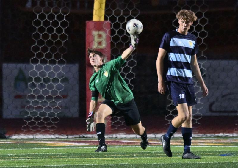 Senior goalie Jake Hutchison makes a pass upfield.