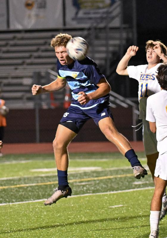 Evan Burris uses his head for a pass upfield.