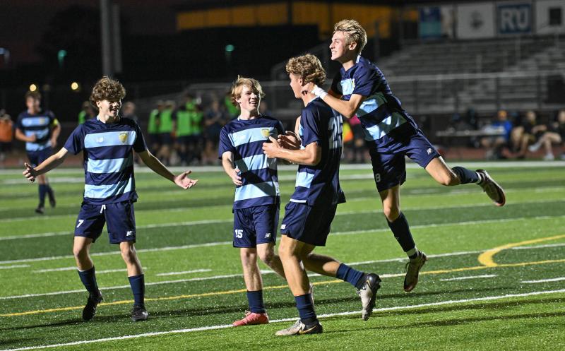 The Cape team swarms Evan Burris after his goal at the 28-minute mark.