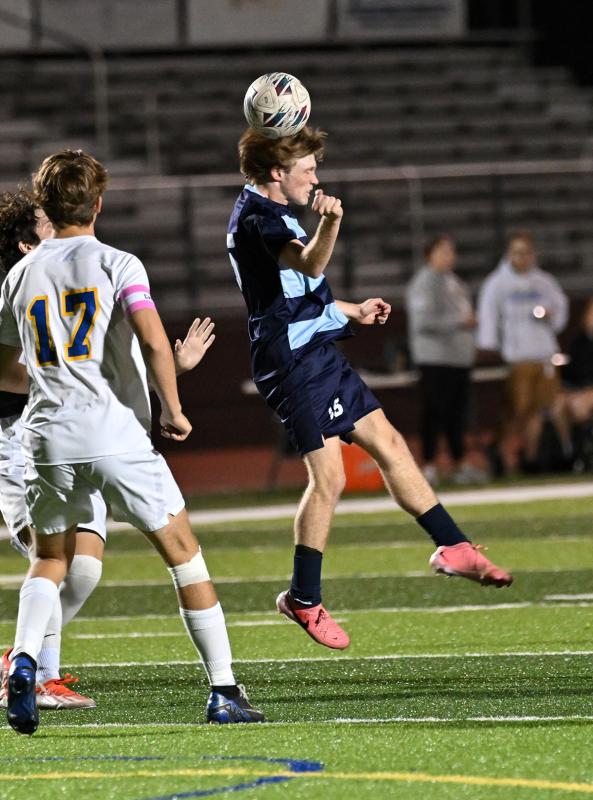 Cape’s Brady Spiegel heads a pass.