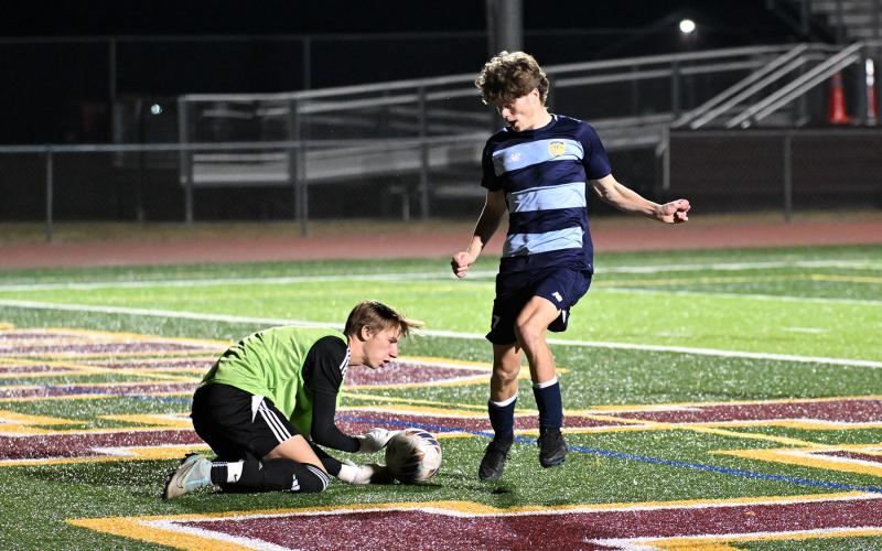 Jack Flynn goes for the ball as CR keeper Grant Parsons makes the save.