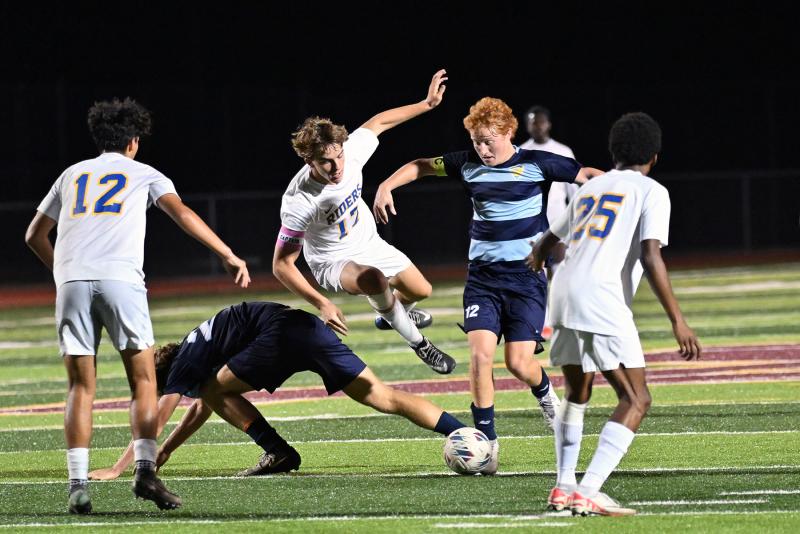 CR’s Axel Jackson and Cape’s Brandon Loucks battle for possession in a crowd.