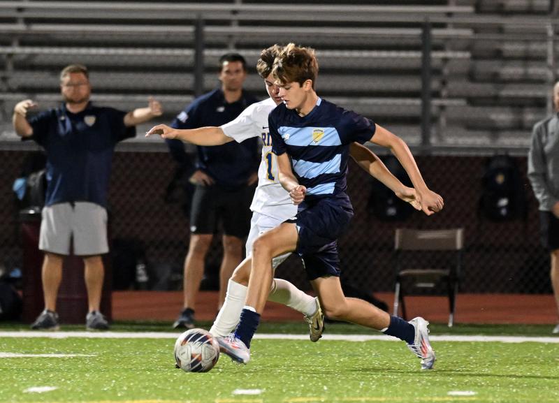 Cape’s Lee Levis speeds the ball up the sideline.