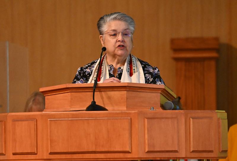 Rabbi Beth Cohen, rabbi emerita from Seaside Jewish Community, reads a prayer of reflection.