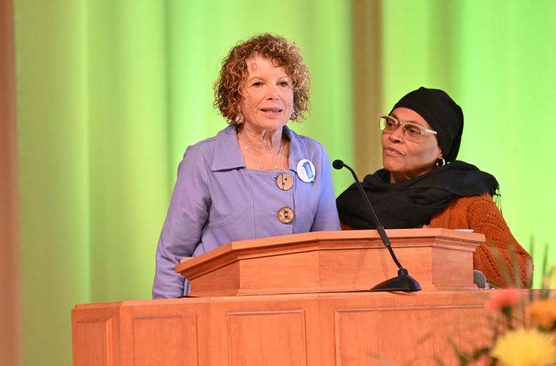 Marjorie Kobrin of the Speak Out Against Hate’s Faith Leaders Action Group introduces the sisters, brothers and siblings groups.