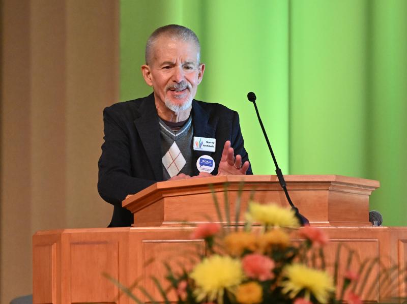 CAMP Rehoboth co-founder Murray Archibald reads “A Place at the Table.”