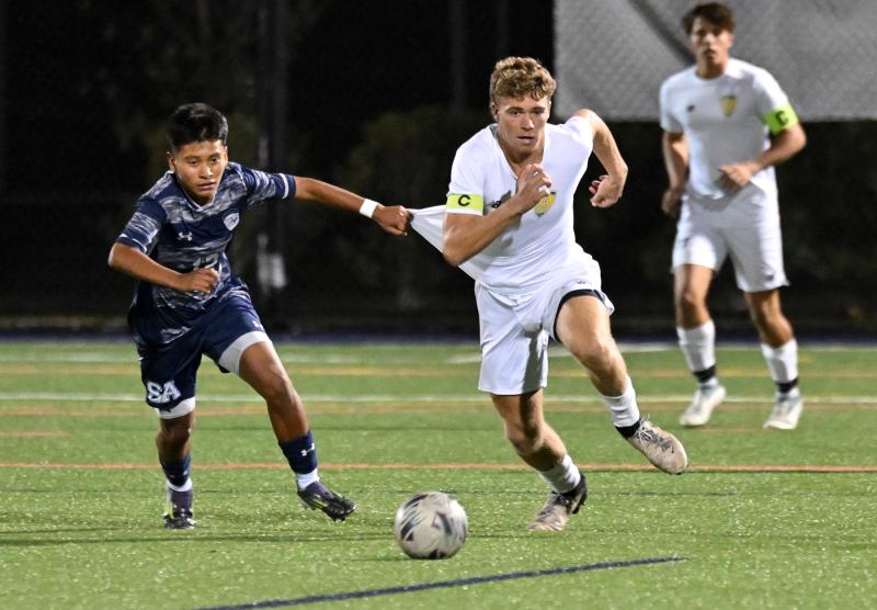 Cape captain Evan Burris gets the advantage for a ball over Sussex Academy’s Richie Velasquez.