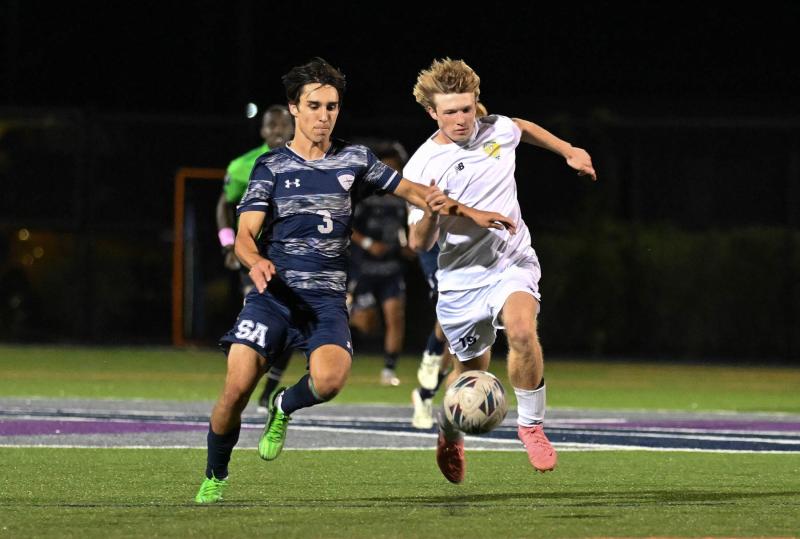 Sussex Academy senior McKenna Danahy battles for possession with Cape’s Brady Spiegel.