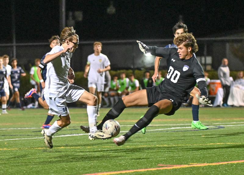 Sussex Academy goalkeeper C.J. Norton makes a stop on Cape’s Cardin Benjamin in the Seahawks’ 2-0 win over the Vikings. DAN COOK PHOTOS