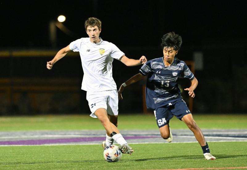 Cape’s Donnacha Hefferan controls the ball from Sussex Academy junior Ruendi Ortiz.