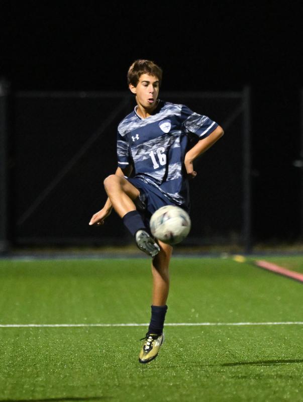 Sussex Academy freshman Bodhi Williams controls play on the sideline.