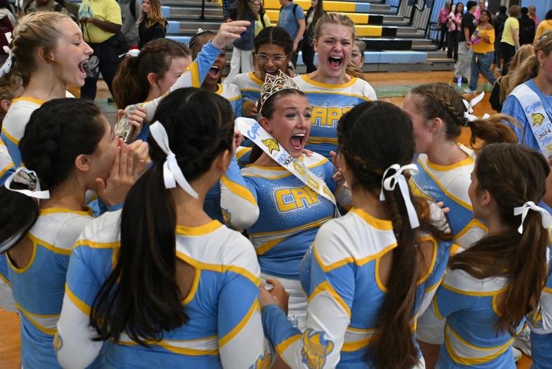 The cheerleaders congratulate Carly Favoroso after the announcement of Homecoming Queen.