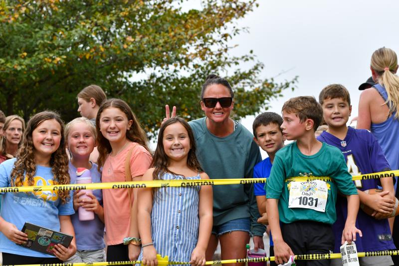 Beacon Principal Kathleen Sheehan and students help out at the Dogfish Dash. DAVE FREDERICK PHOTO