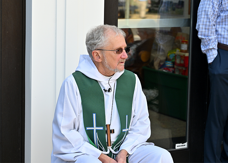Pastor Don Schaefer of the Lutheran Church of our Savior takes a very short break between church service and waiting for the animals.