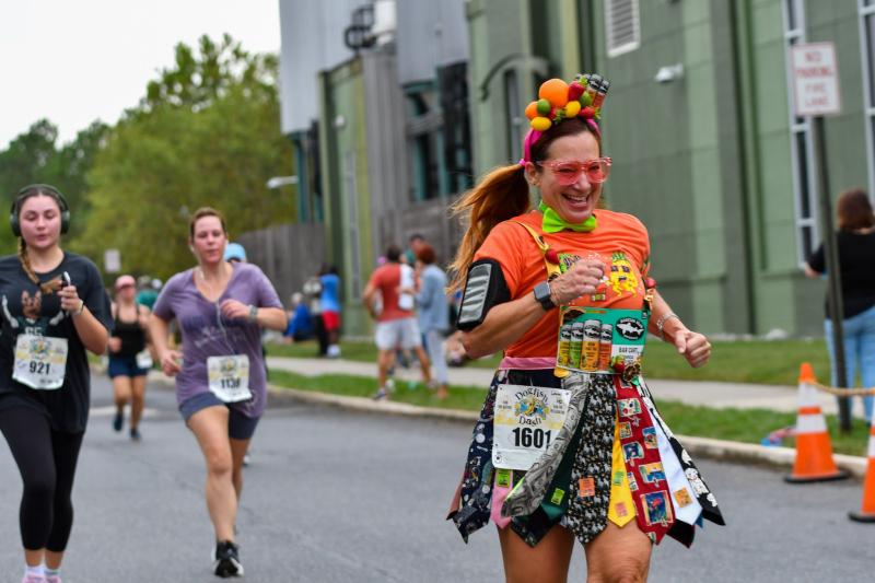 The annual Dogfish Dash attracted more than 1,400 off-centered runners for a 3.8-mile run through the streets of downtown
Milton Sept. 29. As is the norm, several runners donned Dogfish-themed outfits for the race. One of those runners was Laurel Dasher of King of Prussia, Pa., who used Dogfish’s fruity canned cocktails as a theme. DAVE FREDERICK PHOTOS